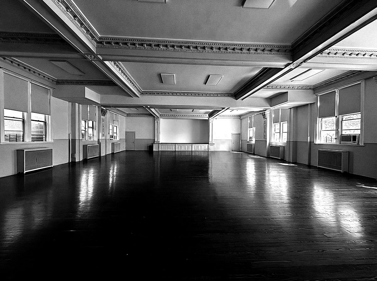 the empty auditorium, coffered ceiling, wood floor