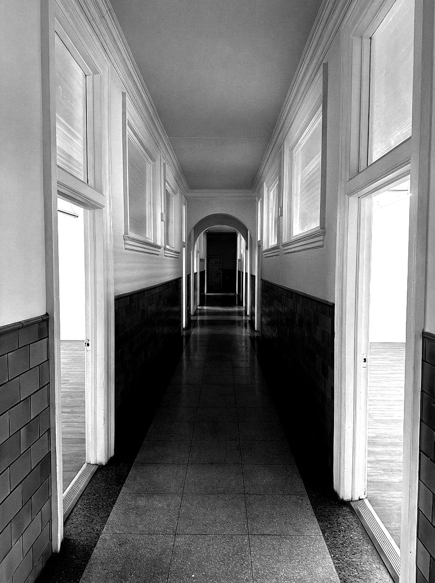 the ground floor corridor, a run of round arches